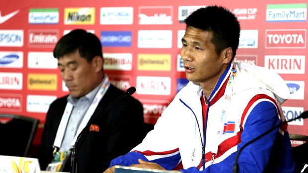 North Korea player Pak Kwang Ryong and coach Jo Tong Sop at a media conference.