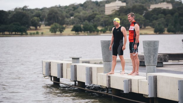 Triathlon ACT's Steve Hough and Craig Johns by Lake Burley Griffin are frustrated with the lasting community perception that Canberra's lakes are unsafe to swim in.
