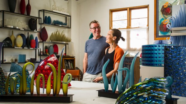 Glass artists husband and wife team, Matt Curtis and Harriet Schwarzrock, in their studio in Queanbeyan.