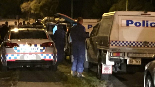 Forensic officers outside the home in Mt Gravatt-Capalaba Rd, Mackenzie, where a 10-year-old boy was found dead.