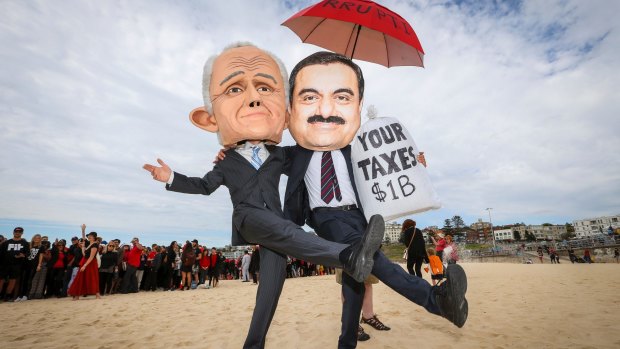 Protesters dressed as Malcolm Turnbull and Gautam Adani at Bondi Beach on Saturday.