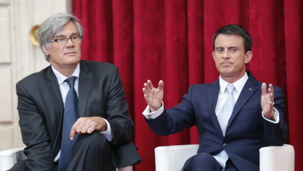 French Minister of Agriculture Stephane Le Foll, left, and French Prime Minister Manuel Valls on Wednesday discuss measures designed to assist French farmers. 