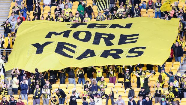 Fighting for their team: Wellington Phoenix supporters hold up a ''Ten More Years'' sign during the clash between Phoenix and the Brisbane Roar at Westpac Stadium last Saturday.