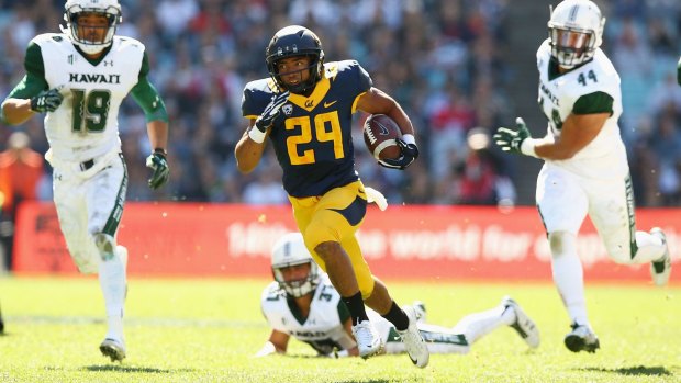 Fleet of foot: Khalfani Muhammad runs the ball for University of California against University of Hawaii at ANZ Stadium.