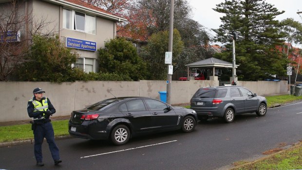 Police outside the Bay Street apartments in Brighton on Tuesday.