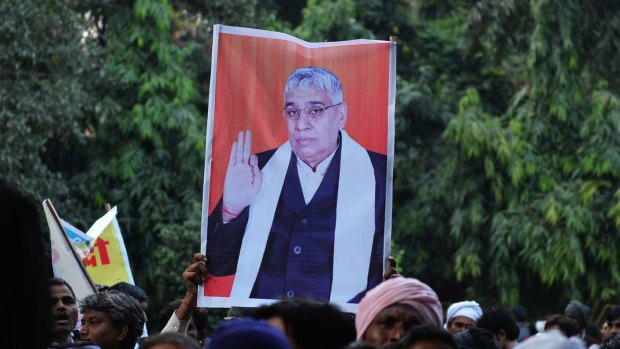 Under arrest: Baba Rampal was taken away from the ashram in an ambulance, police said.