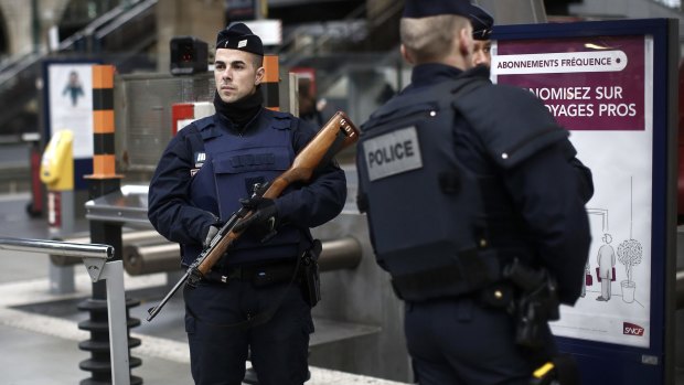 French police officers patrol the platforms at the Gare du Nord train station in Paris, France on Saturday.