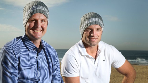 Worthy cause: Mark Hughes and Danny Buderus don their headgear in Newcastle ahead of the NRL's Beanies for Brain Cancer round.