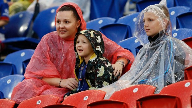 Keen A-League fans defy the wet weather in Newcastle.