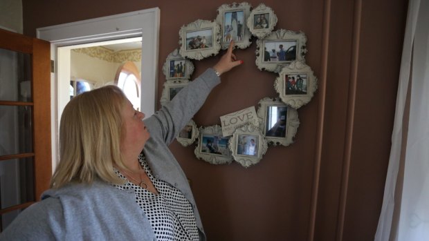 Teri Kroll with photos of her son Tim.