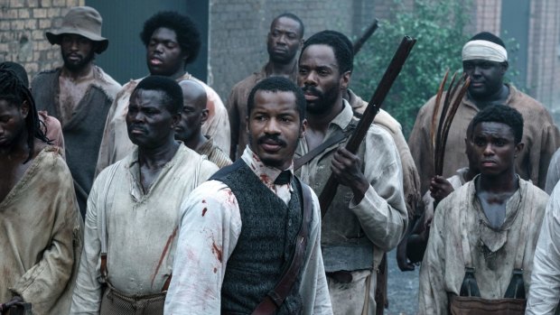 Nate Parker as Nat Turner, centre, in a scene from "The Birth of a Nation". 