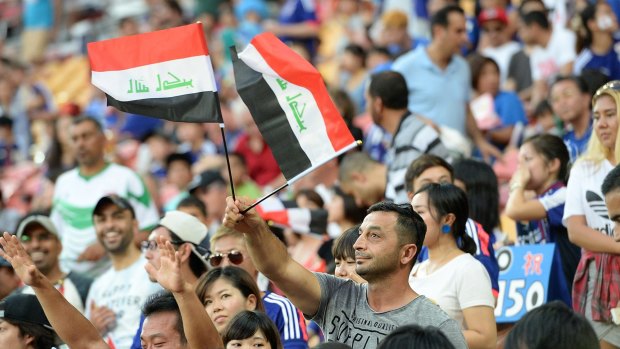 Iraqi supporters enjoying the early stages of their team's match against Japan.