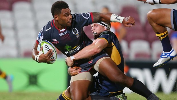 David Pocock of the Brumbies puts the brakes on Samu Kerevi of the Reds.