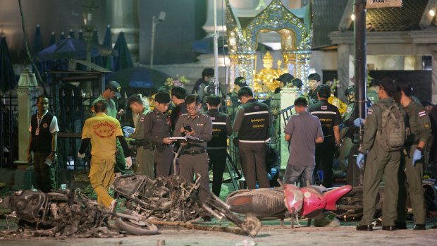 Police investigate the scene at the Erawan Shrine after the explosion in Bangkok in August.