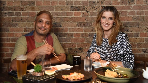 Akmal Saleh and Kate Waterhouse at Saké in The Rocks. Saleh says comedy can change people’s perspective.