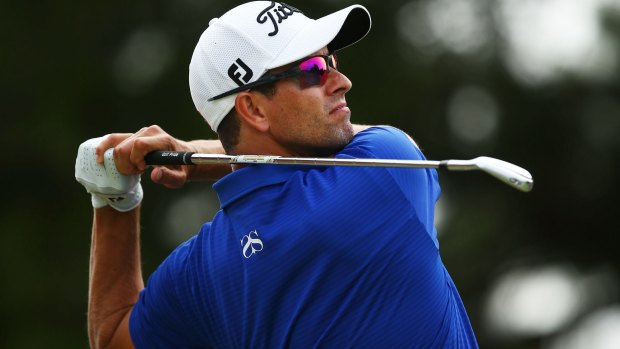 Adam Scott tees off on the fourth hole during day three of the Australian Open on Saturday.