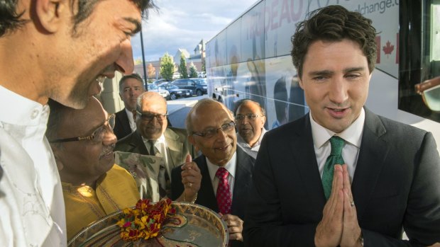 Liberal leader Justin Trudeau shows a traditional Hindu greeting during a Hindu welcoming ceremony in Markham, Ontario.