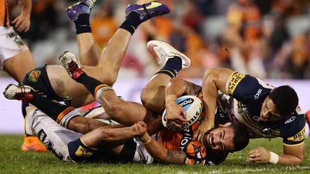 Punished: Saturday's match between the Tigers and Cowboys was minus a host of superstars due to Origin commitments.