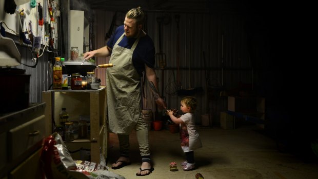 Stewart Wesson, head chef of The Flinders Street Project in Adelaide, cooking in his shed with daughter Lilly. Wesson can be a little less precious in this space, turn up the radio, and let Lilly muck around with his spice blends.