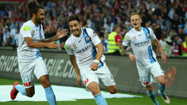 Bruno Fornaroli of Melbourne City (centre) celebrates after scoring his first goal against Perth Glory.