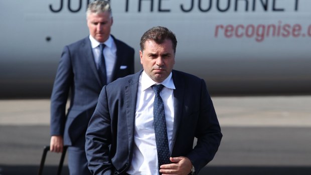 Top man: Ange Postecoglou arrives at Newcastle Airport for the Asian Cup semi-final.