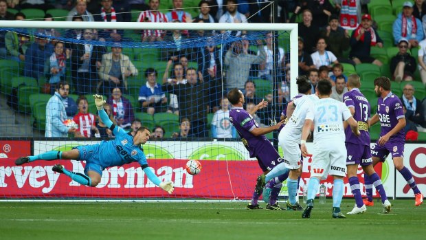 Connor Chapman of Melbourne City scores with a header past Perth Glory goalkeeper Ante Covic.