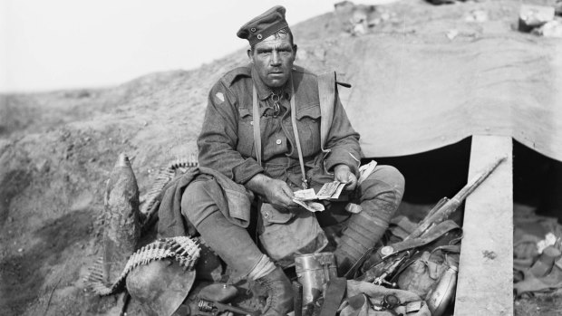 Private John "Barney" Hines, A Company, 45th Battalion, with his trophies (souvenirs) obtained on the morning of the advance of the 4th and 13th Brigades at Polygon Wood. 