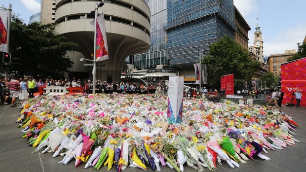 Flowers left as a mark of respect near the site where Monis took 18 people hostage during the fatal siege.