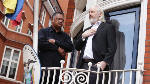 Julian Assange with Reverend Jesse Jackson on the balcony of the Ecuadorian embassy in 2015.