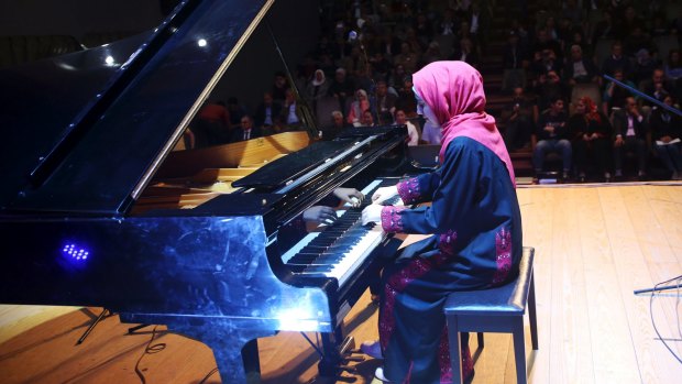 Palestinian pianist Yara Thabit plays the piano to a packed house.