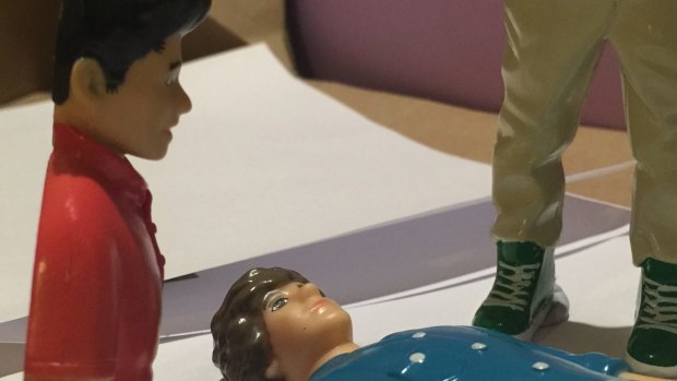 And here, Zayn looks on while Harry lies on the floor ...
