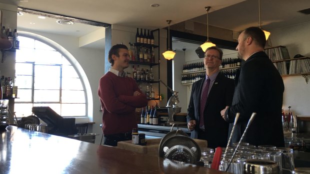 Chief Minister Andrew Barr with Attorney-General Gordon Ramsay and, left, Bar Rochford owner Nick Smith. 