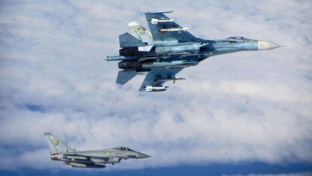 A British Royal Air Force (RAF) Typhoon fighter (bottom) scrambled to intercept a Russian Sukhoi Su-27 fighter in international airspace near the Baltic States last year.
