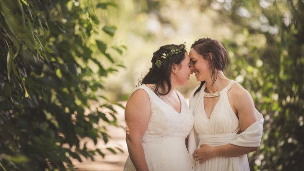Sally and Kara Bromley share a loving moment on their wedding day.