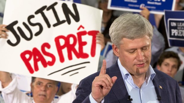 Canadian Prime Minister Stephen Harper at a rally in Montreal on Sunday. The sign reads: "Justin (Trudeau) not ready". 