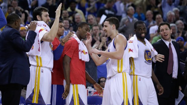 Hot shot: Klay Thompson is congratulated for his record-breaking display against Sacramento by Golden State teammate Andrew Bogut.