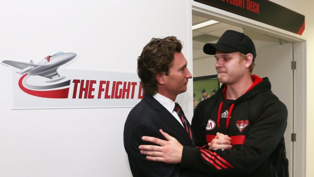 Michael Hurley talks to James Hird after the coach announced his resignation.