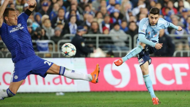 Forced to retire: Chris Naumoff fires a shot past Chelsea's John Terry during their friendly in Sydney last year.