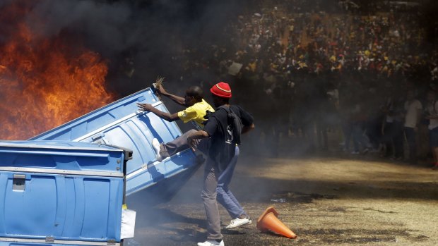 Students burn portable toilets in Pretoria.