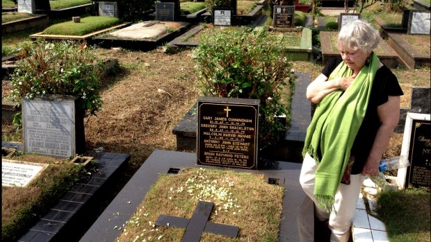 Widow Shirley Shackleton visiting the grave of her dead husband, Greg Shackleton who was killed during the Indonesian invasion in 1975.