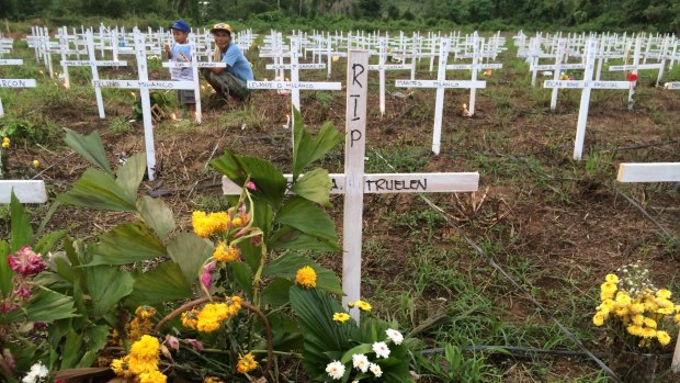Crosses mark the graves of 2600 people buried in Tacloban's Holy Cross Memorial Gardens.