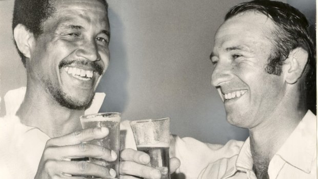 Legend: Sir Garfield Sobers enjoys a beverage with Doug Walters.