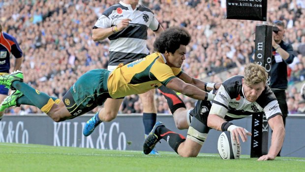 Reds recruit Adam Thomson scores a try for the Barbarians against the Wallabies in November.