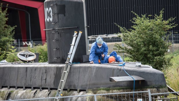 Police technicians on board the home-made submarine UC3 Nautilus.