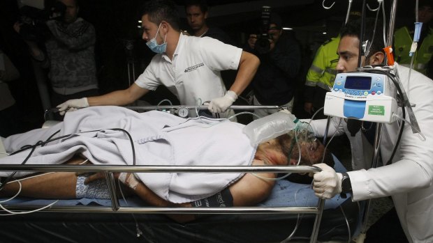 Chapecoense player Alan Ruschel is treated at hospital after surviving the plane crash. 