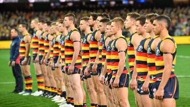 Power stance: the Crows stand for the national anthem before the win over GWS. 