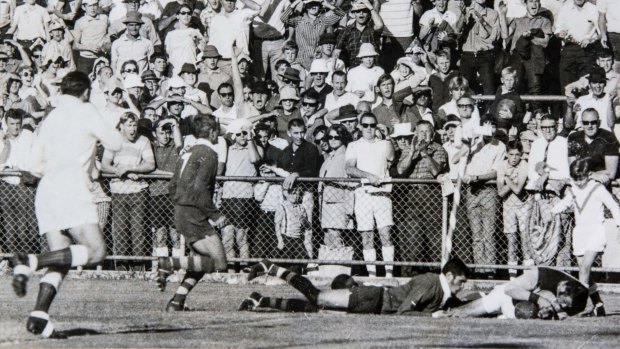 Glory days: Fonda Metassa crashes over in his final game, the 1969 grand final, as Norths took out the Brisbane premiership.