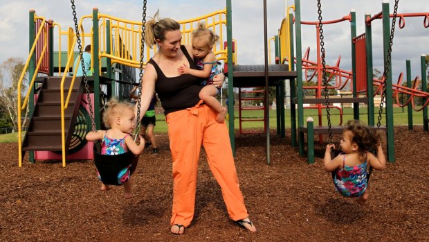 Ms King with her two-year-old triplets, Madisyn, Mariyah and Mackenna in Sydney.