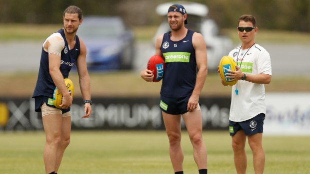 On-ballers: (L-R) Bryce Gibbs, Sam Docherty and coach Brendon Bolton during today's session on the Gold Coast.