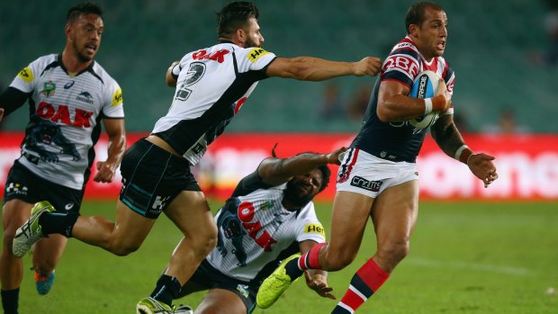 Ferguson makes a break on his way to two tries in the Roosters' win over Penrith last week. 